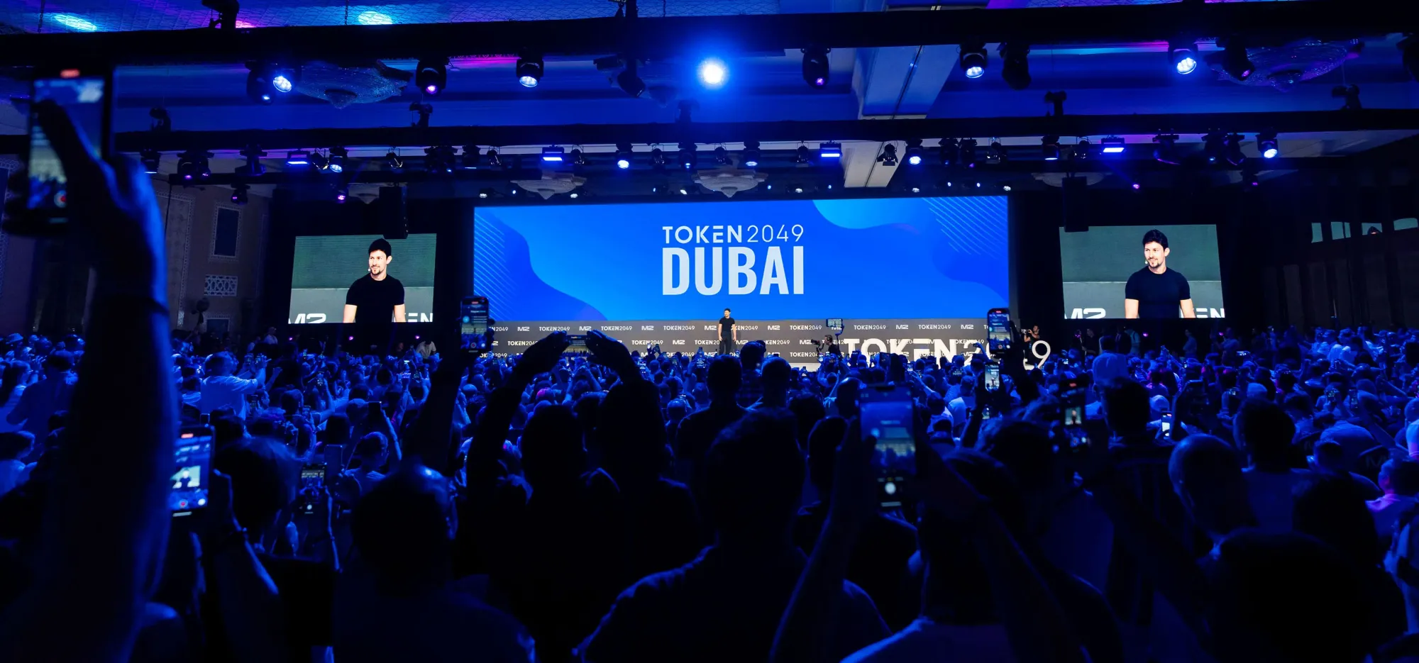 TOKEN2049 Dubai 2025 - Large crowd at crypto event with speakers on stage at Madinat Jumeirah, 30 April - 1 May