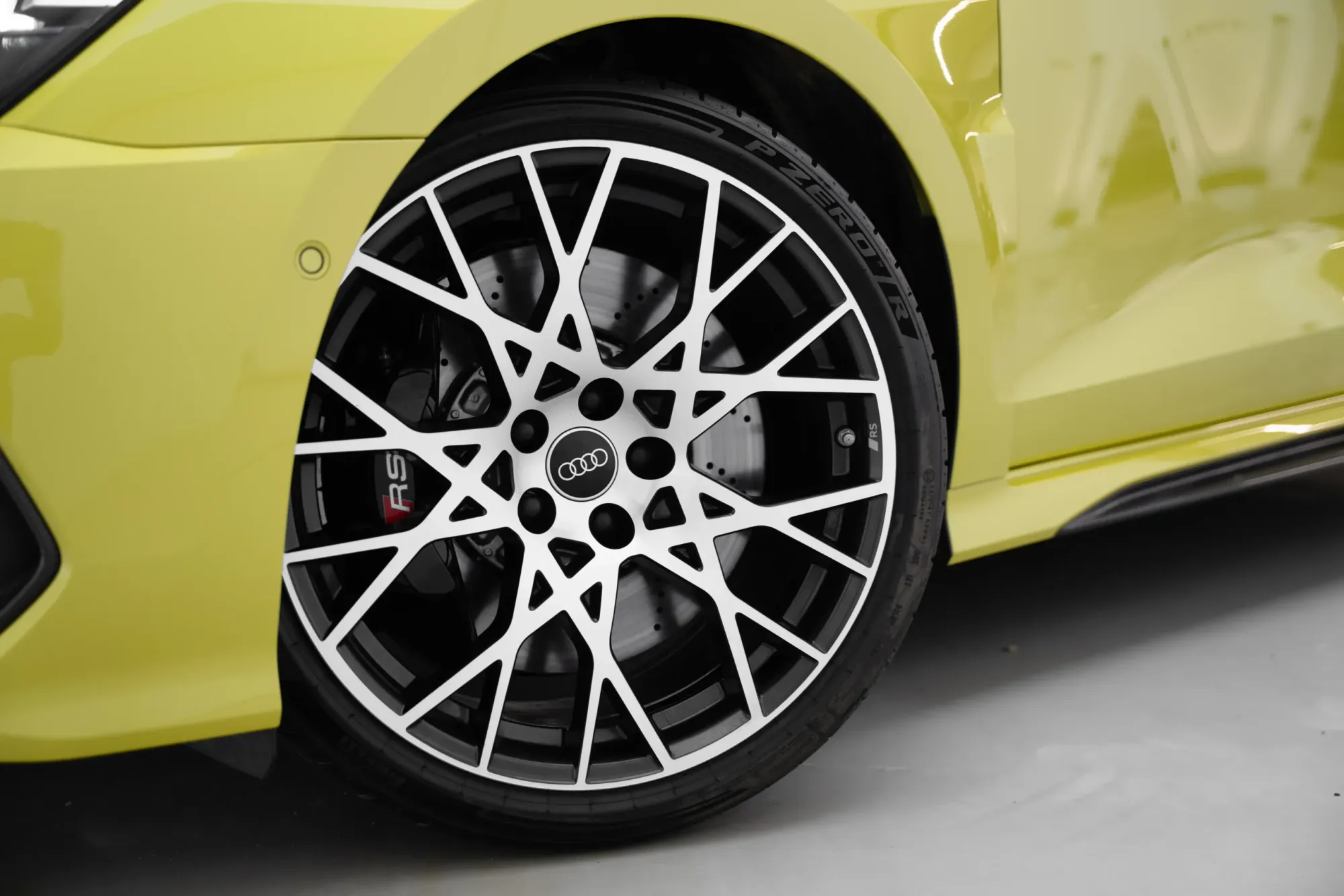 Close-Up of 2024 Audi RS3 Sportback Alloy Wheel and Red RS Brake Caliper – Performance Car Rental in Dubai