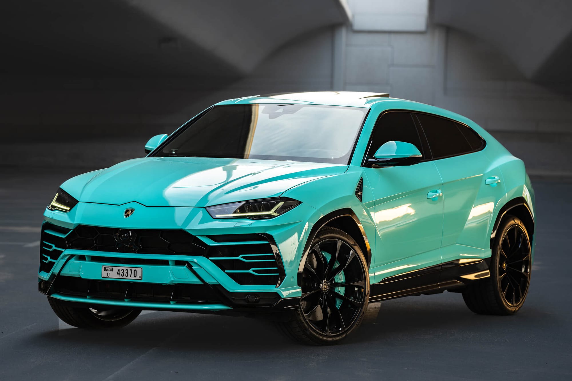 Cyan Lamborghini Urus SUV in Dubai – luxury rental available from Solid Cars with no deposit and 24/7 service