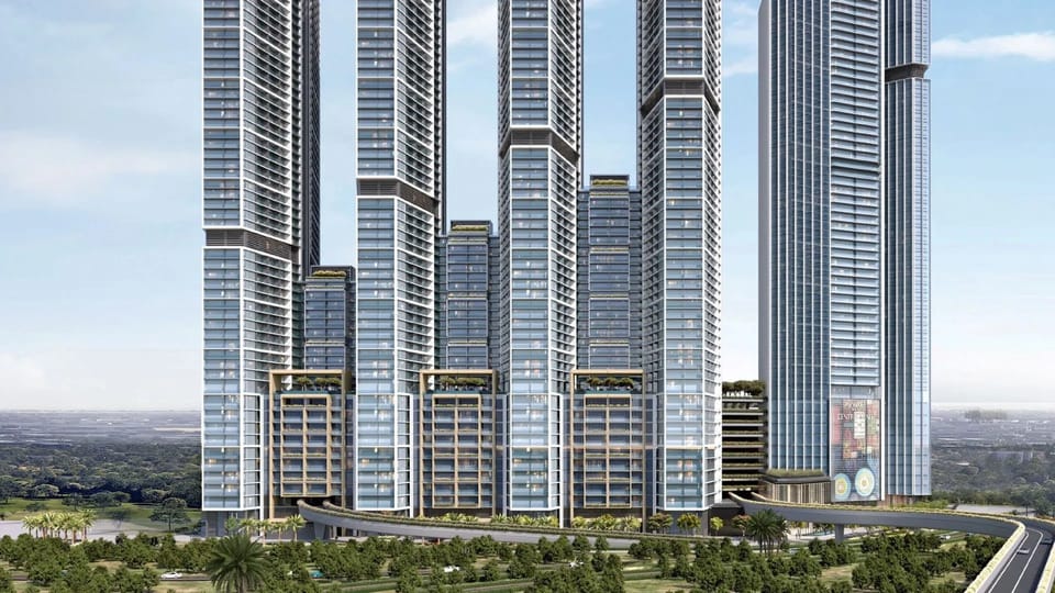 Front view of Sobha Central skyscrapers in Dubai, modern luxury apartments along Sheikh Zayed Road with green spaces.