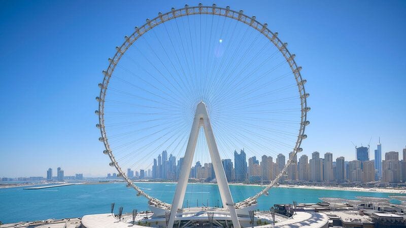 Ain Dubai Ferris wheel on Bluewaters Island with panoramic view of Dubai Marina skyscrapers and blue sea
