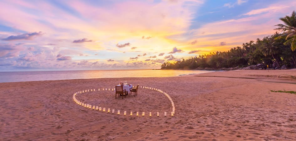 Romantic beach dinner setup at sunset on Al Sufouh Beach, Dubai — a hidden gem known as the “Secret Beach.”