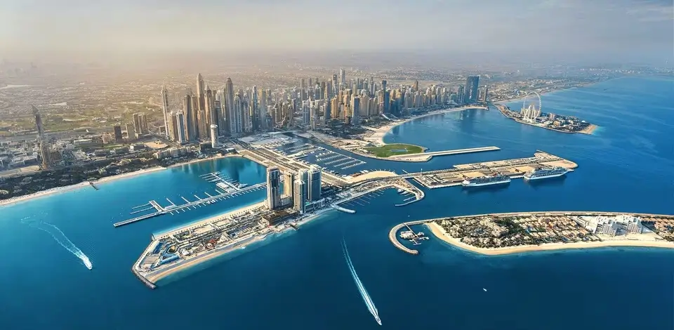 Aerial panoramic view of Dubai Harbour, Marina skyline, cruise terminals, and Bluewaters Island with Ain Dubai