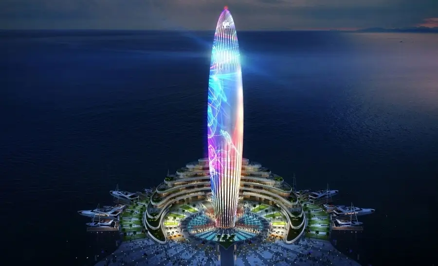 Dubai Harbour Lighthouse illuminated at night with colorful lights, surrounded by marina and luxury yachts