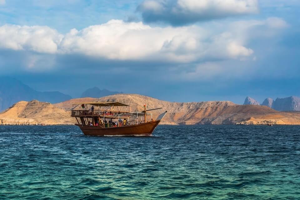 Traditional dhow cruise in Khasab, Oman — sailing through the stunning fjords of Musandam near the UAE border.