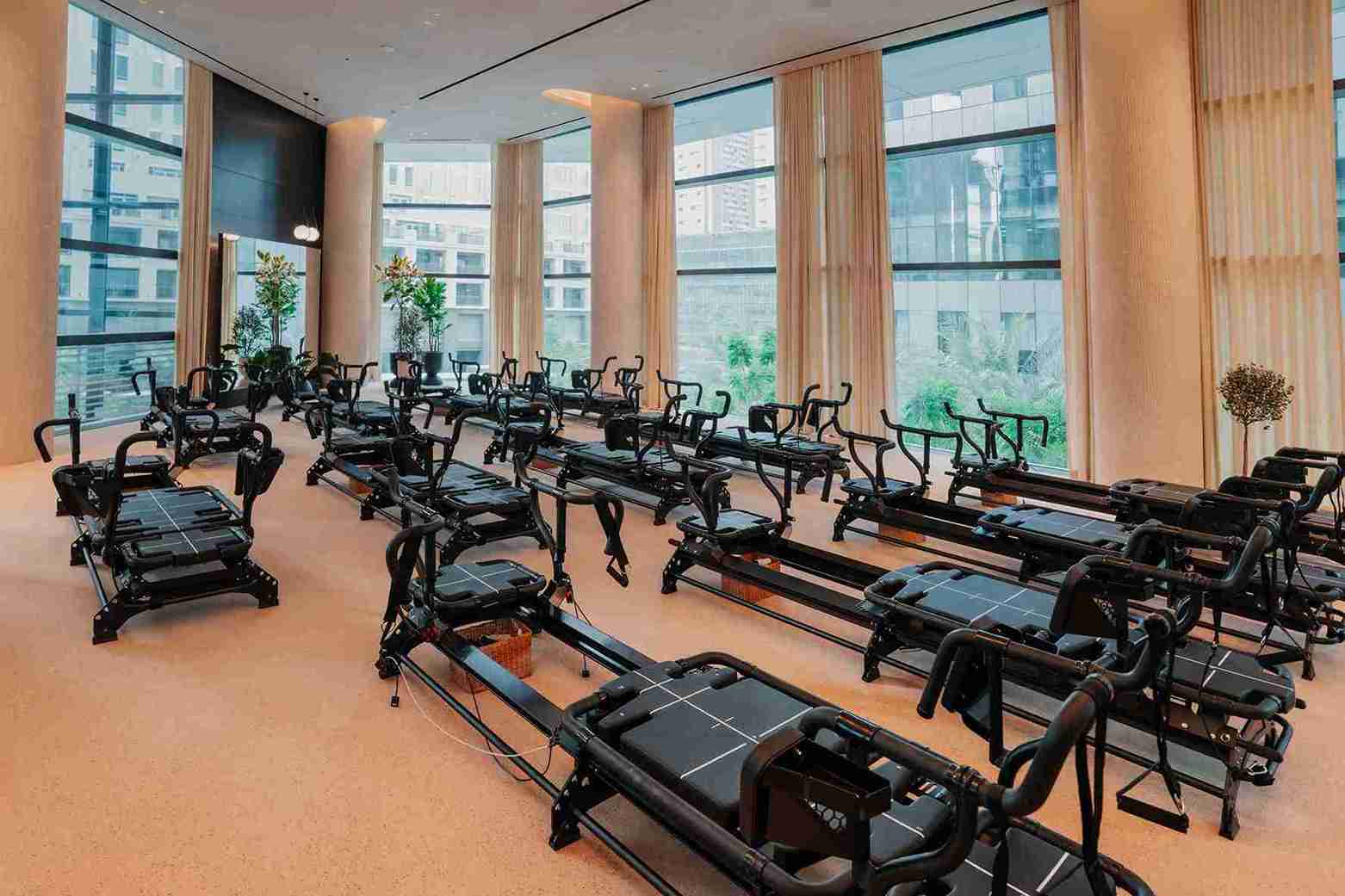 Reform Athletica Dubai Pilates studio with reformer machines in a bright, modern wellness setting in 2025.