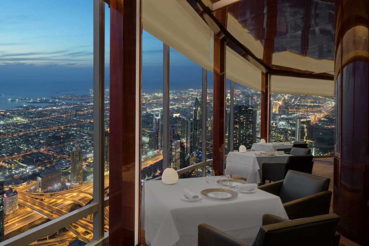 Fine dining table with panoramic night views of Dubai skyline from At.mosphere in Burj Khalifa