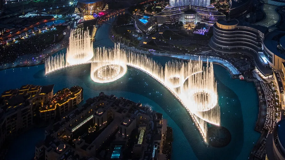 Dubai Fountain Show at night in Downtown Dubai, lights and water jets creating a spectacular free attraction