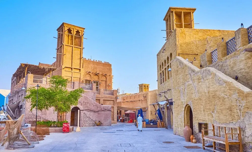 Al Fahidi Historical Neighbourhood in Dubai – traditional wind towers and old architecture on a sunny day