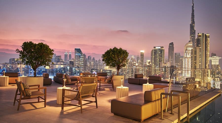 High Society rooftop lounge at The Lana Dubai with sunset city views and Burj Khalifa in the background