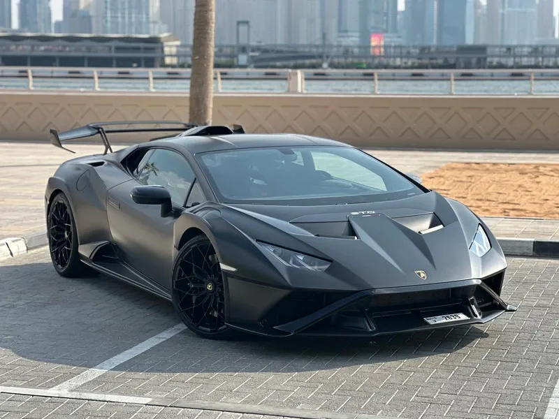 Black Lamborghini Huracán STO at Solid Cars, high-performance supercar rental in Dubai with free delivery and no deposit