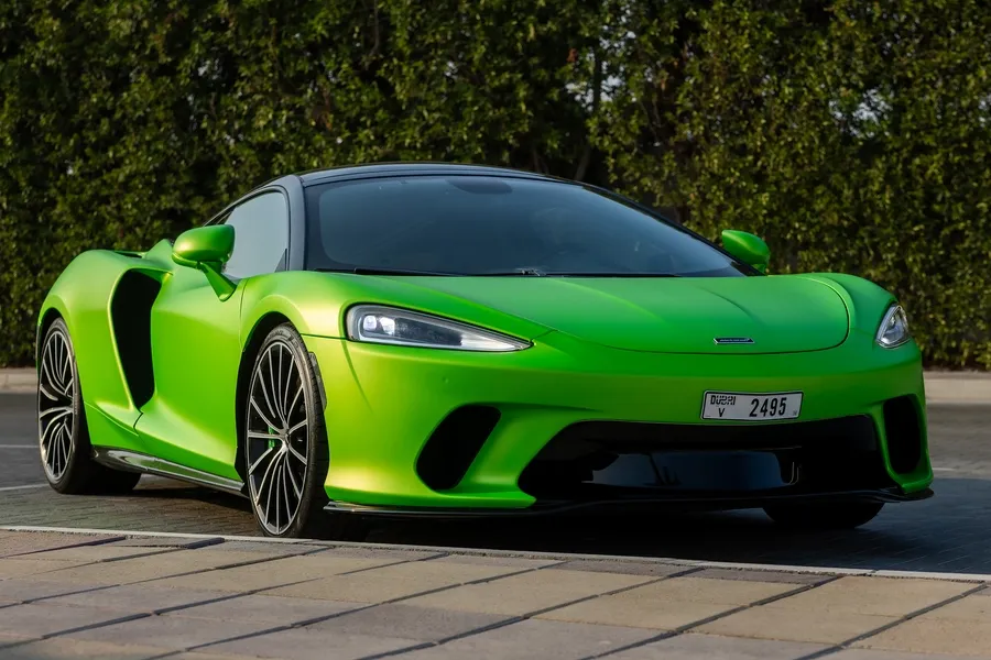 Green McLaren GT Luxe at Solid Cars, exotic supercar rental in Dubai with 24/7 delivery, instant booking, and no deposit