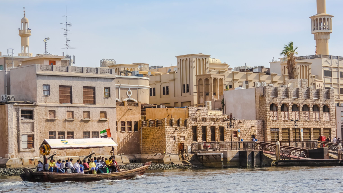 Traditional abra boat crossing Dubai Creek in Old Dubai, highlighting cultural charm and safety for solo travelers in 2025