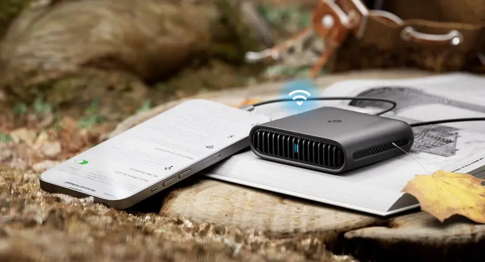 Portable pocket Wi-Fi device next to a smartphone for internet access in Dubai.