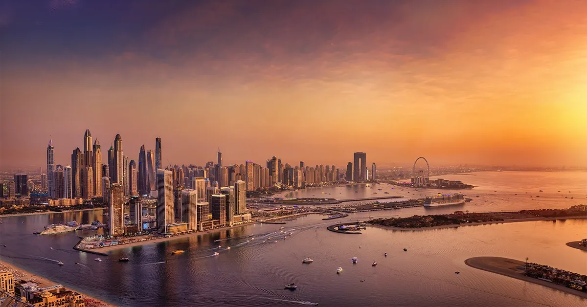 Dubai Marina skyline at sunset with waterfront and Ain Dubai view