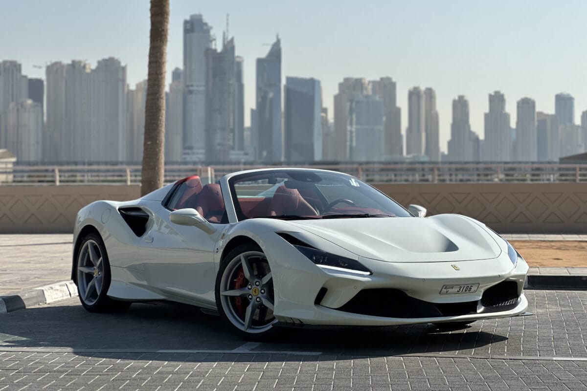 White Ferrari F8 Spider convertible in Dubai, luxury Italian supercar rental ideal for city cruising and scenic drives