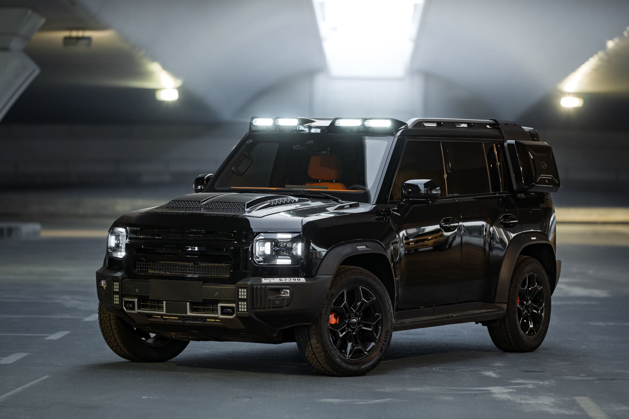 Black Jetour T2 SUV rental in Dubai parked under tunnel lights, budget-friendly adventure car