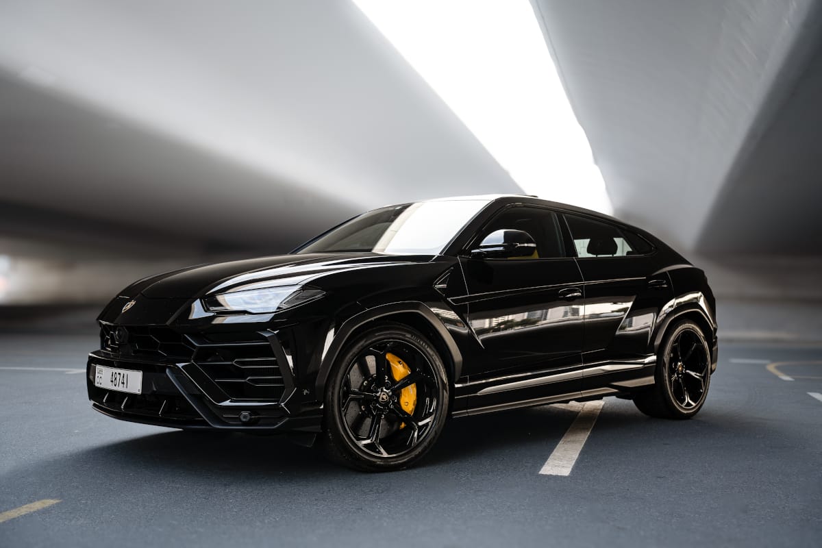 Black Lamborghini Urus luxury SUV in Dubai, highlighting driving rules for tourists renting cars in 2025