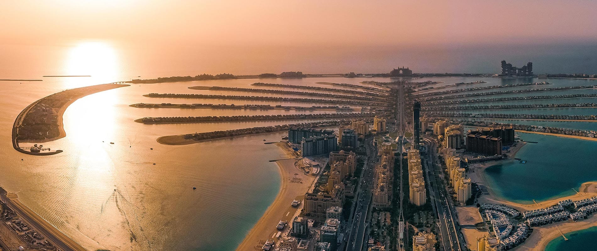 Aerial view of Palm Jumeirah in Dubai with luxury villas and apartments available for foreign property buyers