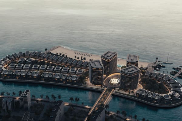 Aerial view of Brabus Island luxury waterfront residences in Umm Al Quwain, UAE at sunset.