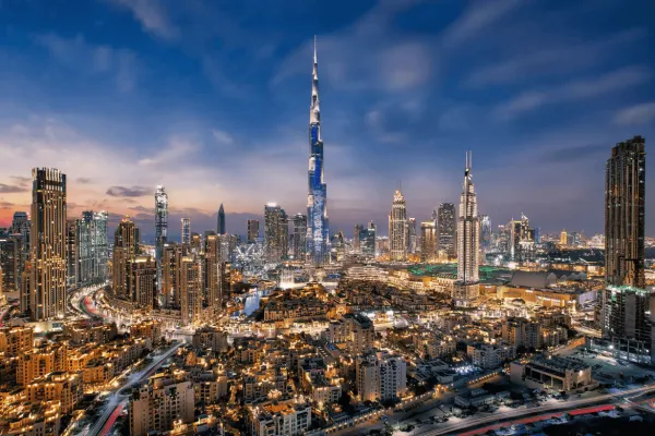 Stunning night view of Downtown Dubai skyline with Burj Khalifa, highlighting the city's real estate landscape in 2025.