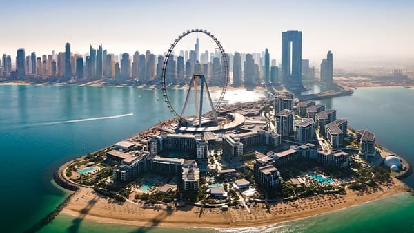 Aerial view of Ain Dubai and Bluewaters Island with beach resorts and Dubai Marina skyline in the background
