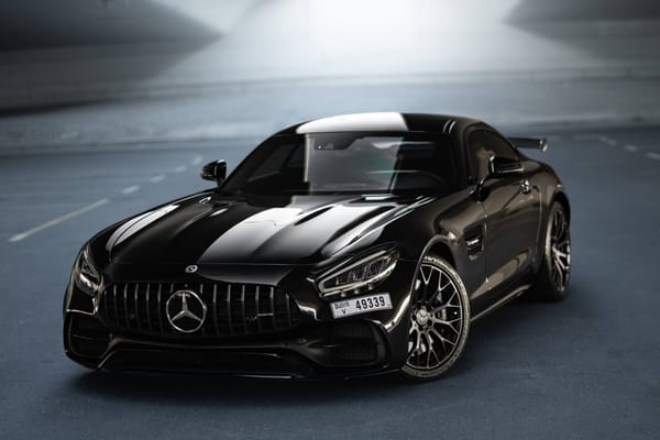 Black Mercedes-AMG GT Night Edition parked in Dubai, luxury sports car rental from Solid Cars