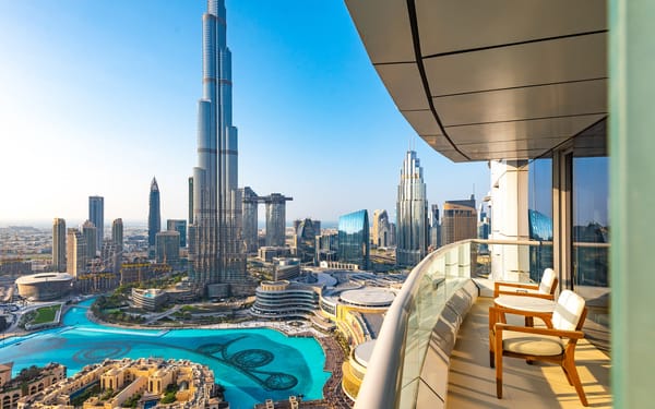 Downtown Dubai balcony view of Burj Khalifa and fountains, showcasing modern expat lifestyle in 2025