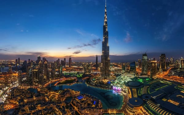 Dubai skyline at night with Burj Khalifa and city lights highlighting the city’s modern architectural marvels