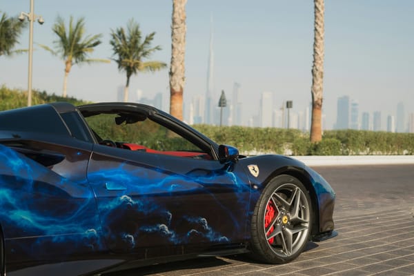 Ferrari F8 Spider luxury car rental in Dubai with Burj Khalifa skyline in the background