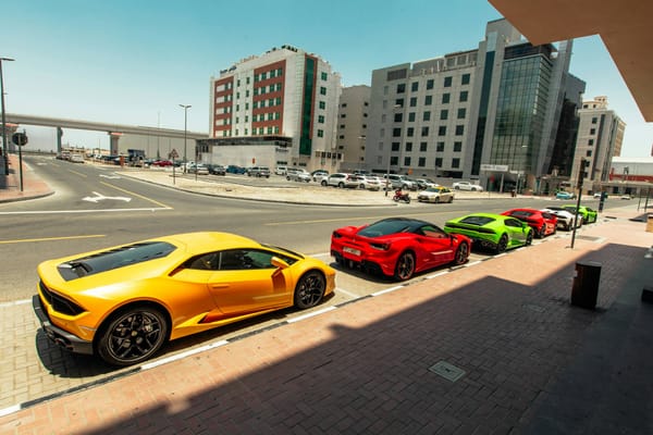 Line of luxury sports cars parked in Dubai, perfect for tourists renting vehicles and learning driving rules in 2025